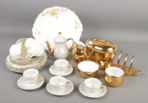 A collection of bone china. Includes Royal Worcester gilt teawares, Czechoslovakian lustre coffee