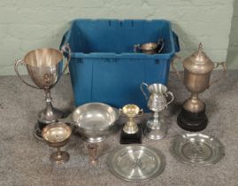 A box of metal trophies and plaques. Includes large twin handle examples, etc.