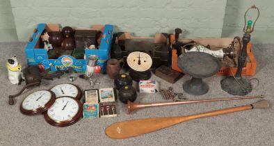 Three boxes of miscellaneous. Includes lawn bowls, ornate metal table lamp, wooden stand, mincers,