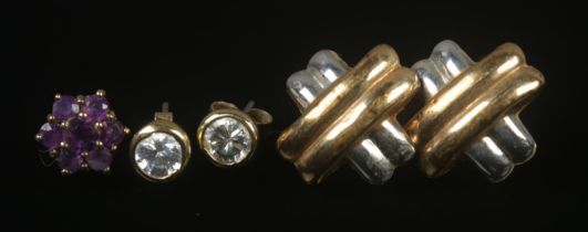 A collection of 9ct gold earrings to include two pairs and one odd example. Total weight 3.44g.