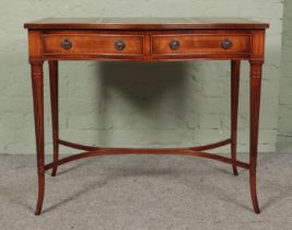 Hunter and Smallpage of York mahogany, leather inset console table featuring serpentine front and