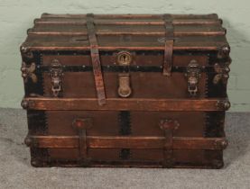 A large wooden bound trunk featuring Eagle Co. locks. Approx. dimensions 60cm x 87cm x 53cm.