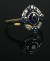 An Art Deco cluster ring, set with diamonds and sapphire coloured stones. Size LÂ½. Total weight: