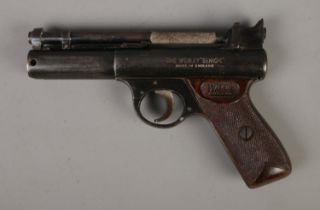 A Webley "Senior" 0.22 cal air pistol featuring chequered grips. CANNOT POST OVERSEAS.