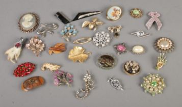 A good collection of costume jewellery brooches to include cameo, floral and prospecting examples.