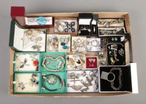 A tray of assorted silver and white metal jewellery, including pheasants foot and Viking brooches,