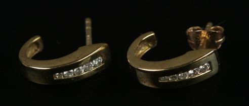 A pair of 9ct gold and five stone diamond earrings. Total weight 2.06g.