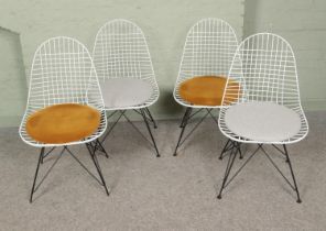 Four Concorde Interiors wire chairs featuring upholstered seats.