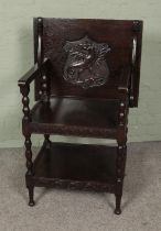 An oak three tier folding top table/hall chair featuring carved dragon cartouche. Approx. dimensions