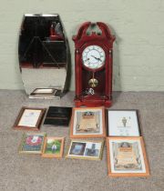 A 31 Day wall clock along with a bevel edge wall mirror and collection of framed military pictures.