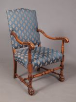 A French style carved walnut throne chair raised on paw feet. Height of back 113cm.