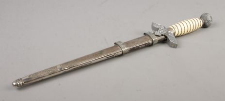 A German Third Reich Luftwaffe dagger. Having eagle and Swastika cross guard, ivory coloured grip