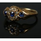 An 18ct Edwardian diamond and sapphire ring. Size L, 2.8g.