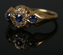An 18ct Edwardian diamond and sapphire ring. Size L, 2.8g.