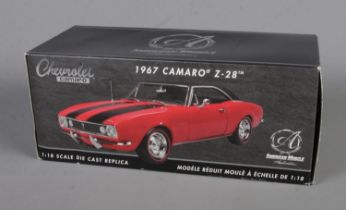 A boxed ERTL American Muscle Authentics 1/18th scale Chevrolet Camaro Z-28. (No. 33272)