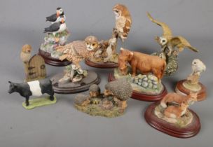 A quantity of composite animal figures. Includes Border Fine Arts Puffins, Country Artists, etc.