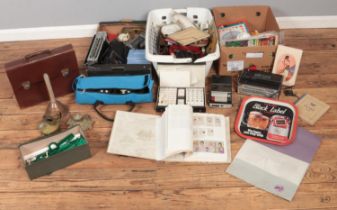 Three boxes of miscellaneous. Includes radios, table top cricket game, knife handles, Black Label