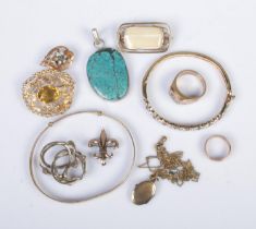 A collection of assorted vintage jewellery to include rolled gold locket on chain, silver bangle,