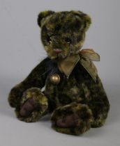 A modern jointed teddy bear by Charlie Bears. Named Lime Pickle, No. CB181852A.