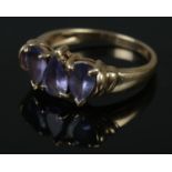 A 9ct gold three stone tanzanite ring. Size N, 3.05g.