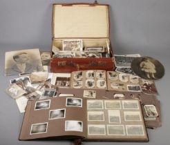 A case of monochrome postcards and photographs. Includes military examples, etc.
