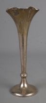 A silver stem vase with fluted top on circular foot with weighted base assayed Birmingham 1907. 73.