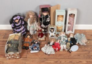 A box of assorted porcelain dolls to include the Leonardo Collection, Curzon Collection and