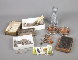 A box of assorted collectables to include Brooke Bond cigarette cards, silver plated cutlery and