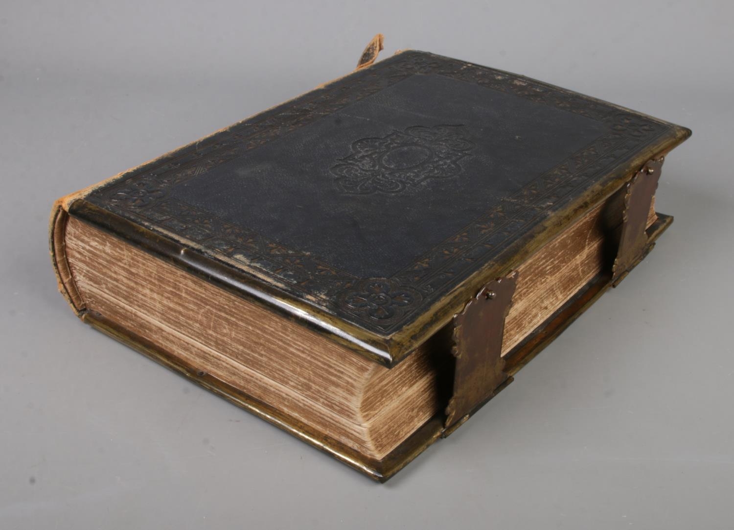 A leather bound William Collins and Sons, Glasgow family bible.