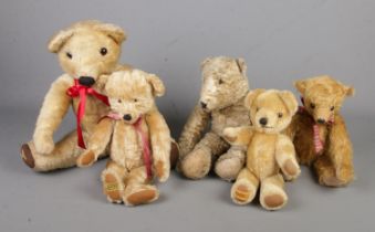 A collection of teddy bears to include two Merrythought examples and vintage examples.