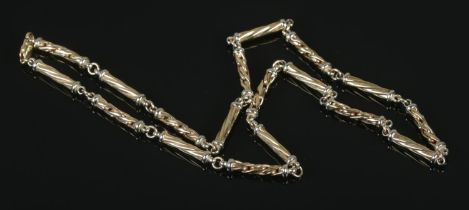 A 9ct yellow and white gold cylindrical link necklace. Length 55cm. 27.5g.