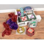 A box of assorted Christmas decorations to include baubles, tinsel, star tree topper, etc.