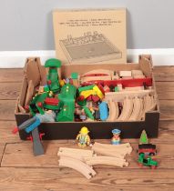 A box of assorted Brio play set pieces along with a boxed Ikea Shut The Box game.