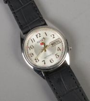 A men's Seiko 5 automatic wristwatch featuring leather strap and day date display. Working