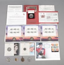 An assortment of coins and stamps, to include Platinum Jubilee, Millennium and '150th anniversary of