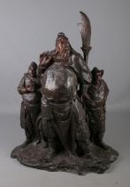 A large bronze figure group depicting three oriental warriors. Indistinct signature to reverse of