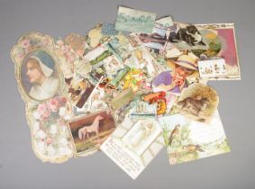 A large quantity of Victorian scraps of various themes with a folder of religious scraps/calendar
