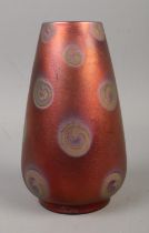 A Burmantofts Faience lustre vase, possibly by Joseph Walmsley, decorated with swirls. Height