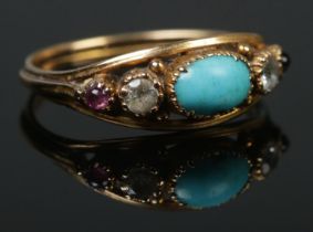 An antique gold turquoise, ruby and clear stone ring. Tested. Size N. 2.12g.