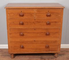 A pine chest of drawers with painted finish