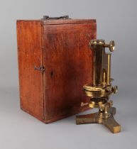 A cased R & J Beck cased brass microscope with selection of accessories and lenses. Not all