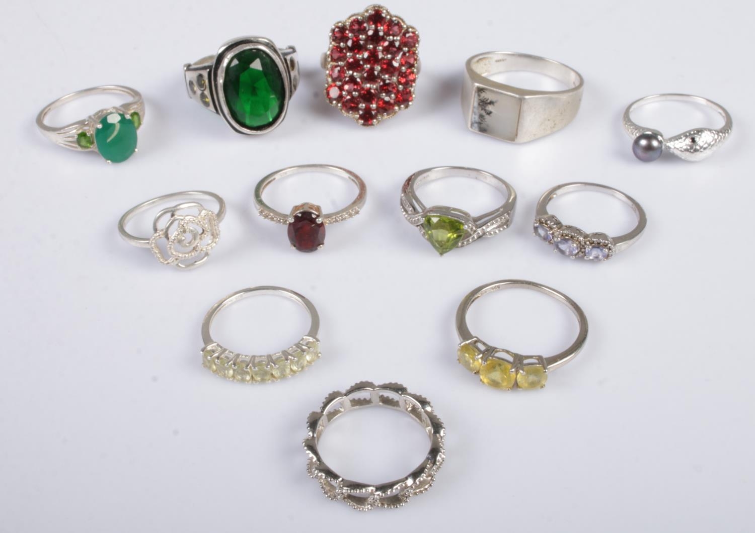 Twelve silver dress rings. Includes coloured paste set examples, etc. 50g