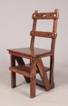 An Arts & Crafts mahogany metamorphic library step chair. Height of steps 90cm. Loose joint