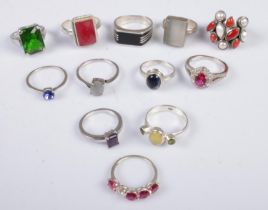 Twelve silver dress rings. Includes colour and clear paste stone examples, etc. 53g