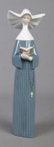A Lladro figure depicting nun titled Prayful Moment. (Number 5500)