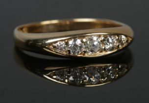 An 18ct gold five stone diamond ring in boat shape setting. Central stone approximately 0.25ct. Size