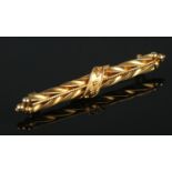 A 15ct gold brooch with twisted decoration. 2.74g.