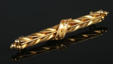 A 15ct gold brooch with twisted decoration. 2.74g.