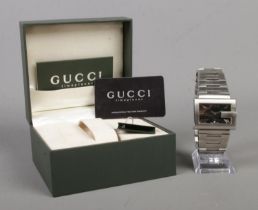 A Gucci G-Collection gents quartz wristwatch, with rectangular 'G' shaped dial and date window to