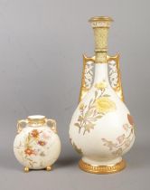 A large late 19th century Worcester porcelain blushware twin handled vase along with a similar Royal